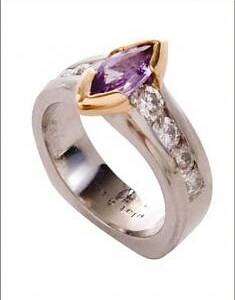 .85ct Pink Sapphire Center with .63cttw Diamonds