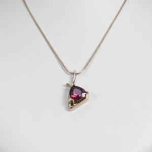 Trillion rubelite set in 14k yellow