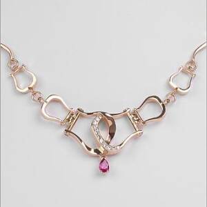 14k Yellow Gold with .41cttw and .65cttw Pear Shaped Ruby