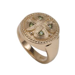 A 14k yellow gold ring with .24cts of Green Diamonds from the above