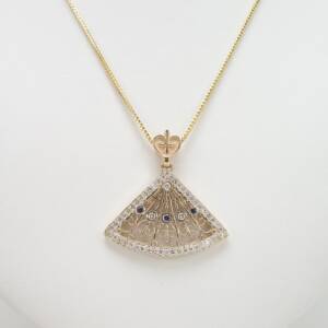 A 14k Yellow gold pendant with .81cts of diamonds and .10cts of sapphires - Albany City Hall