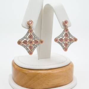 Platinum and 14K rose gold earrings with .44cts of rose diamonds and .68cts of diamonds