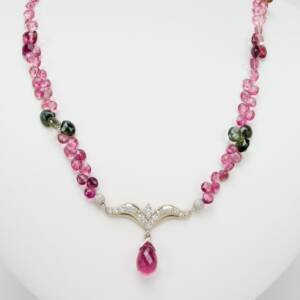 3.83ct ruby briolettes with .58cts of diamonds and a .24ct princess cut diamond centered on  a pink and green  tourmaline briolettes necklace necklace