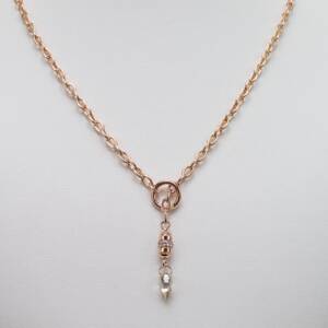A natural .75ct champagne diamond briolette on a 14k rose gold chain with a rose gold bead