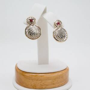 14Ktwo tone earrings with  1.50cts of diamonds with .50cts of Ruby cabochons