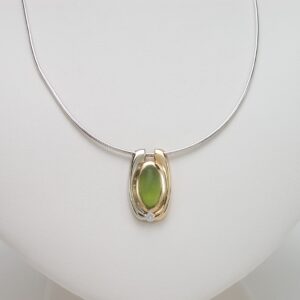 Peridot Cabochon with .06cts of Diamonds 14K two tone